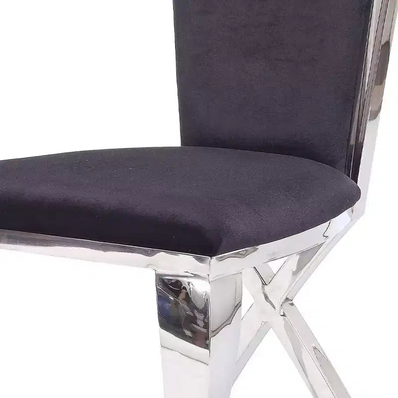Silla auxiliar de comedor tapizada en cuero negro, estructura de acero inoxidable, capacidad para 1 persona