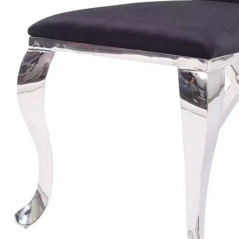 Silla auxiliar de comedor tapizada en cuero negro, estructura de acero inoxidable, capacidad para 1 persona