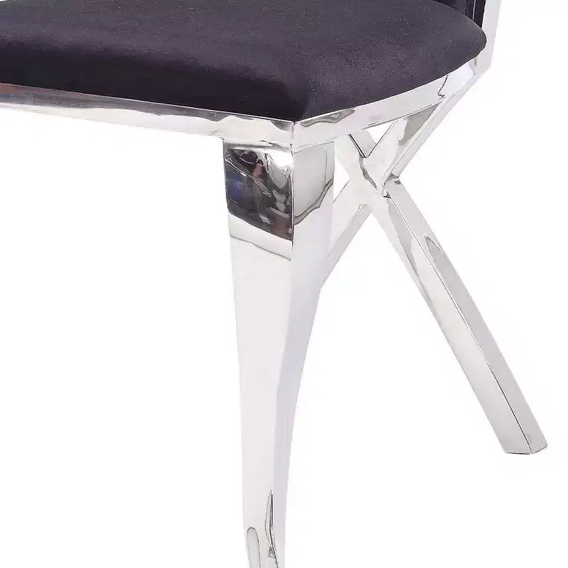 Silla auxiliar de comedor tapizada en cuero negro, estructura de acero inoxidable, capacidad para 1 persona